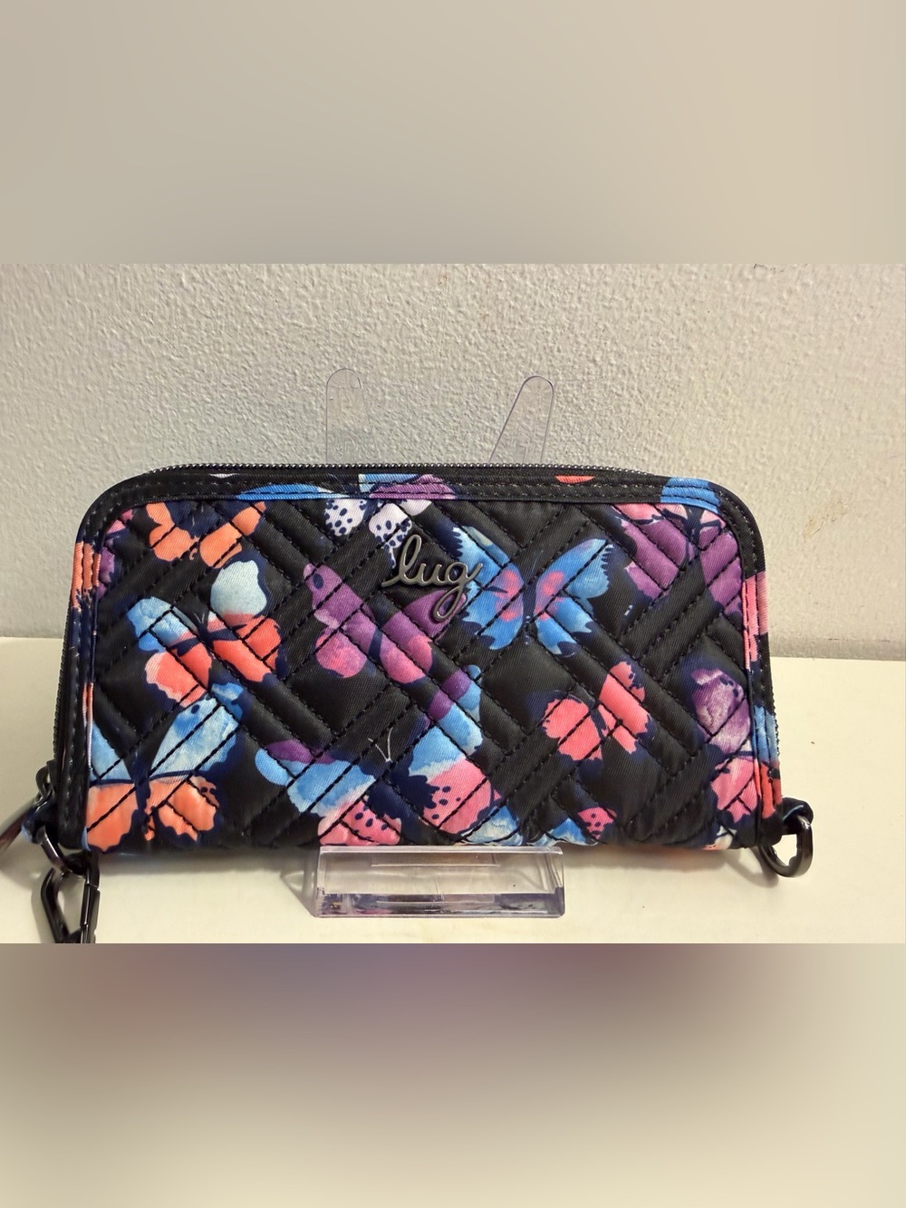 Lug quilted RFID wristlet/ wallet -black background with butterfly pattern.